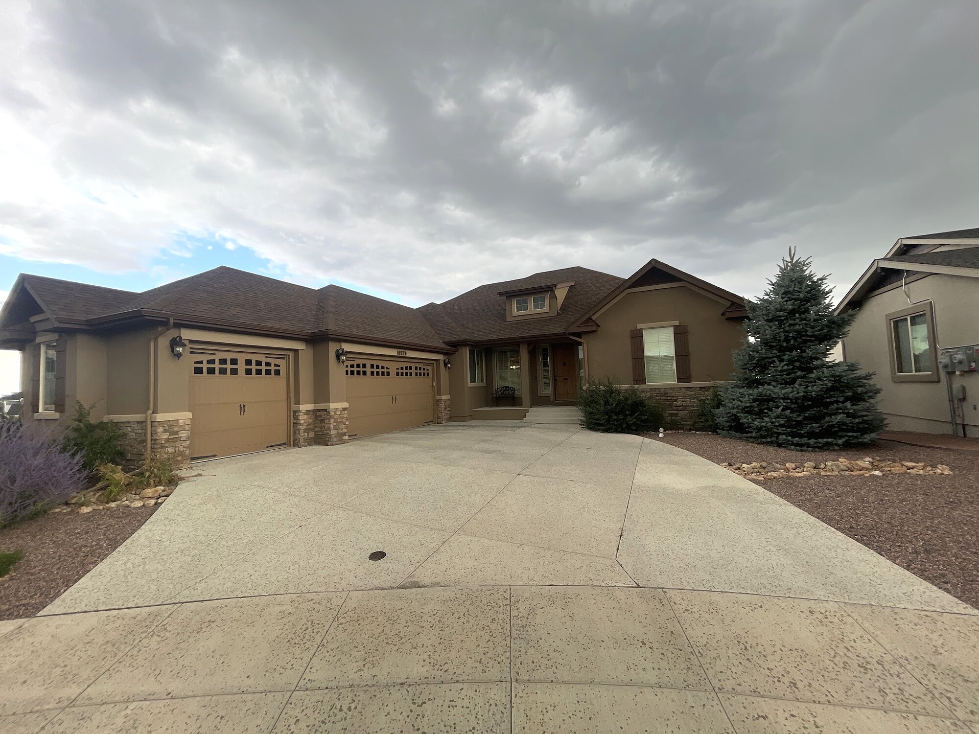 Large textured concrete driveway at an estate home in Colorado Springs.
