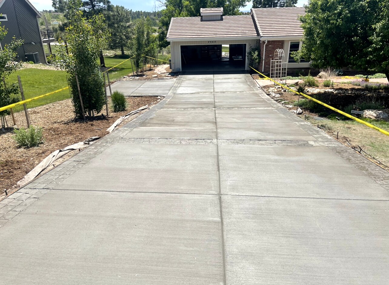 Long newly replaced concrete residential driveway in Colorado Springs.
