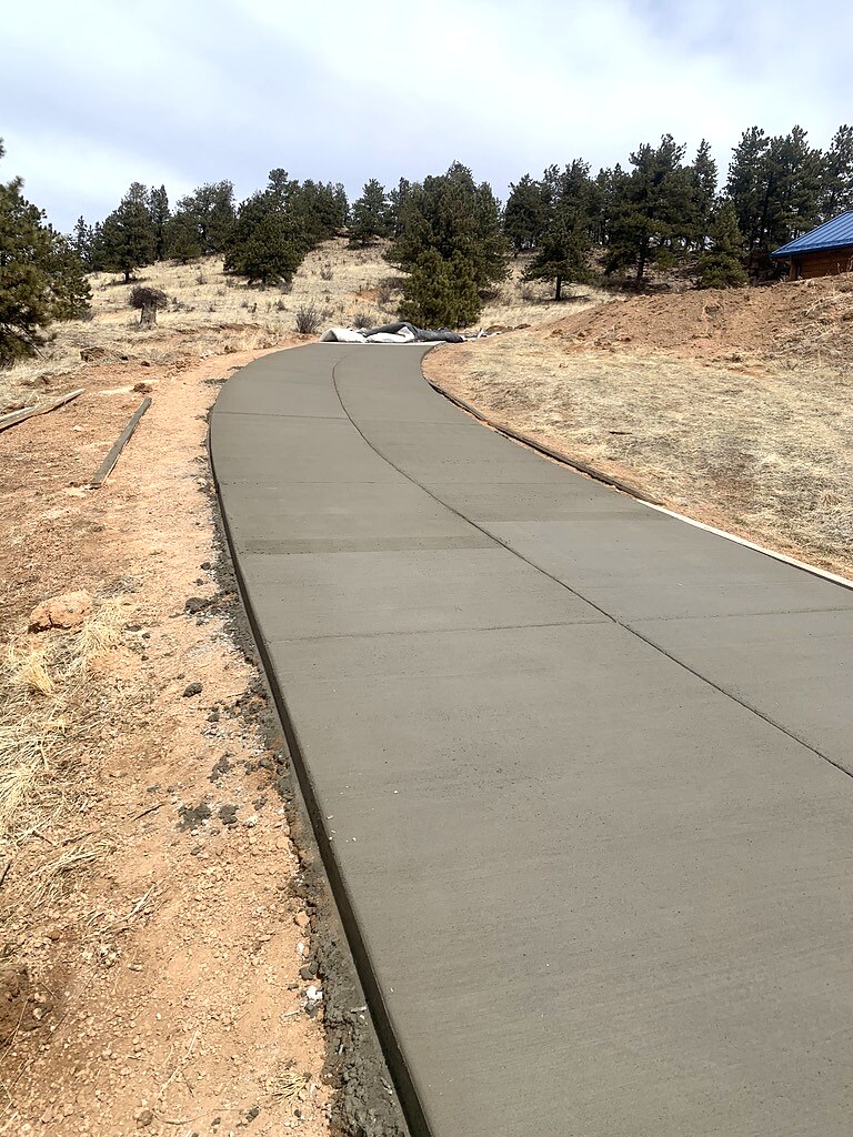 Long rural concrete driveway in the foothills near Colorado Springs.