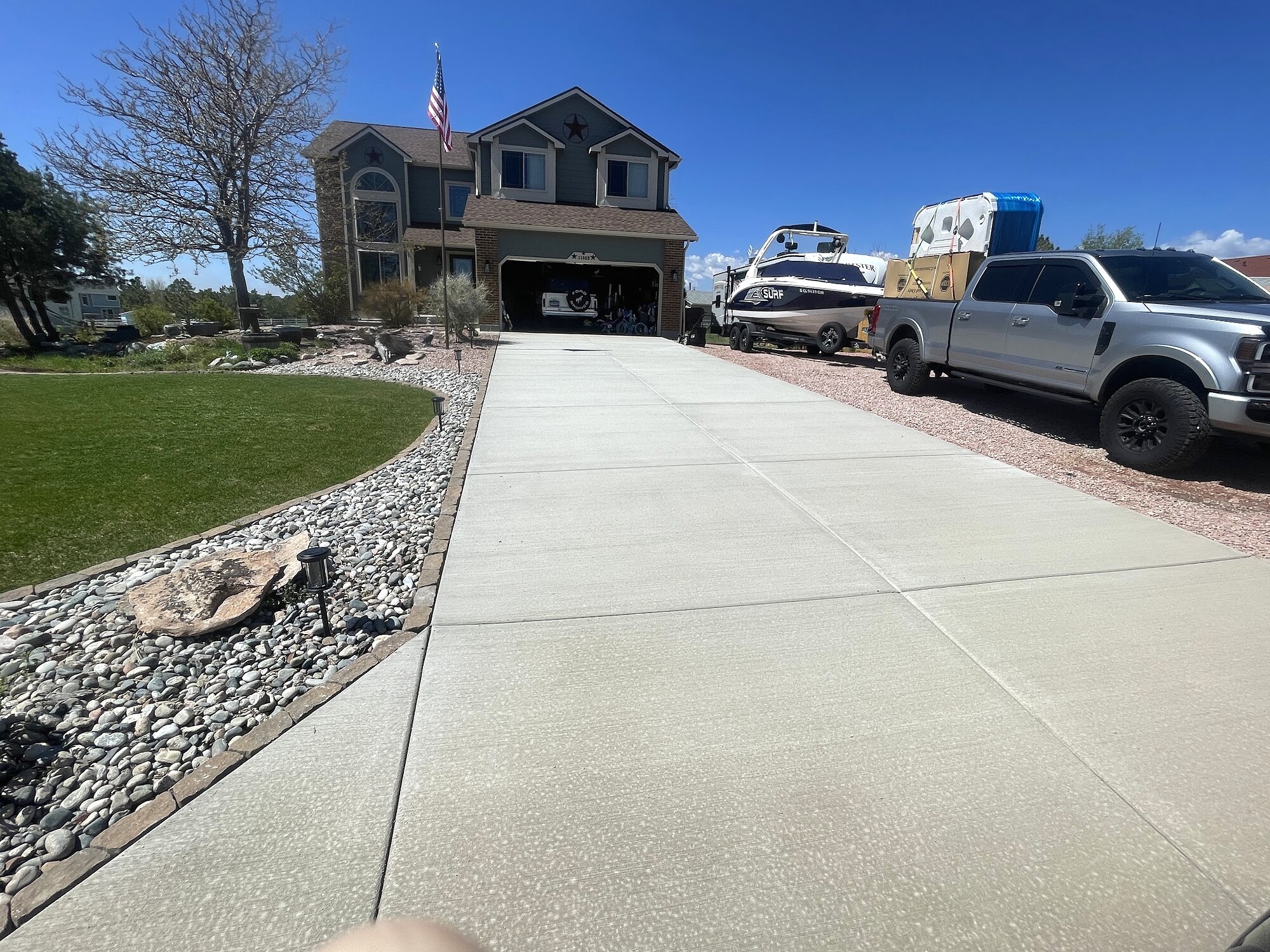Expansive concrete driveway at an upscale two-story home in Colorado Springs.