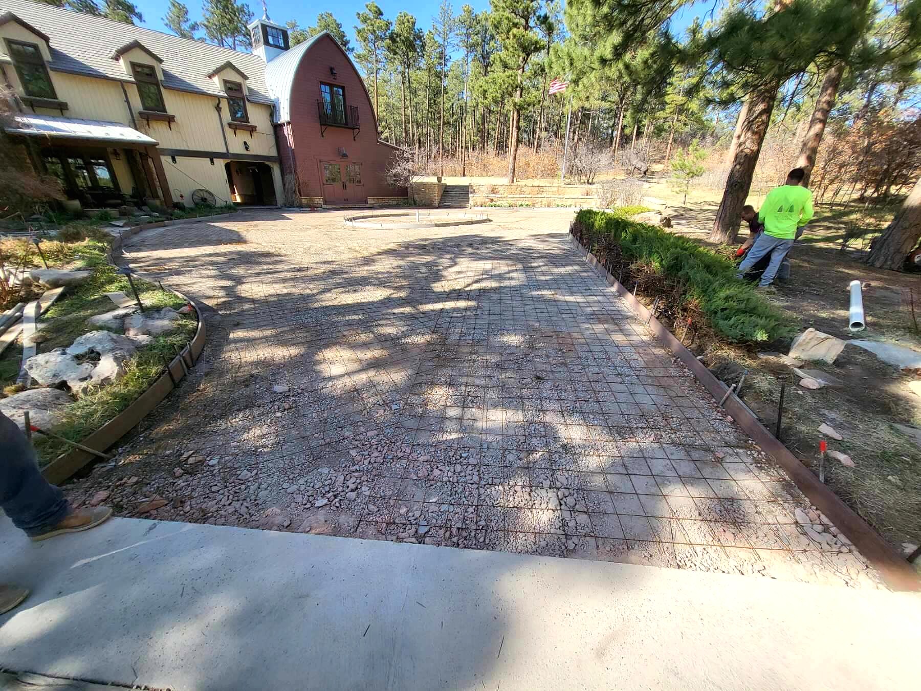Decorative paver driveway at a wooded custom home in Colorado Springs.