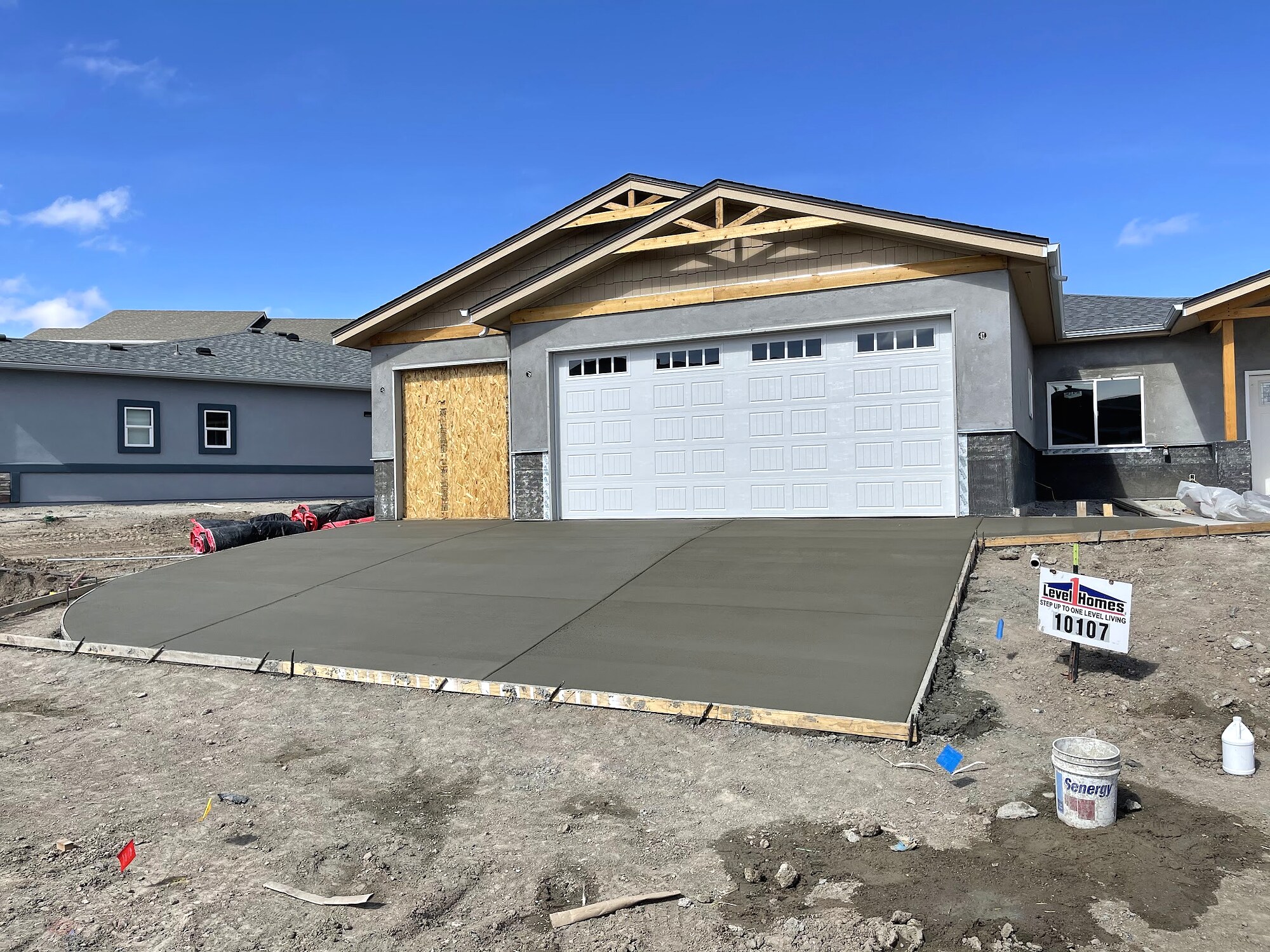Freshly placed concrete driveway at a newly built home in Colorado Springs.