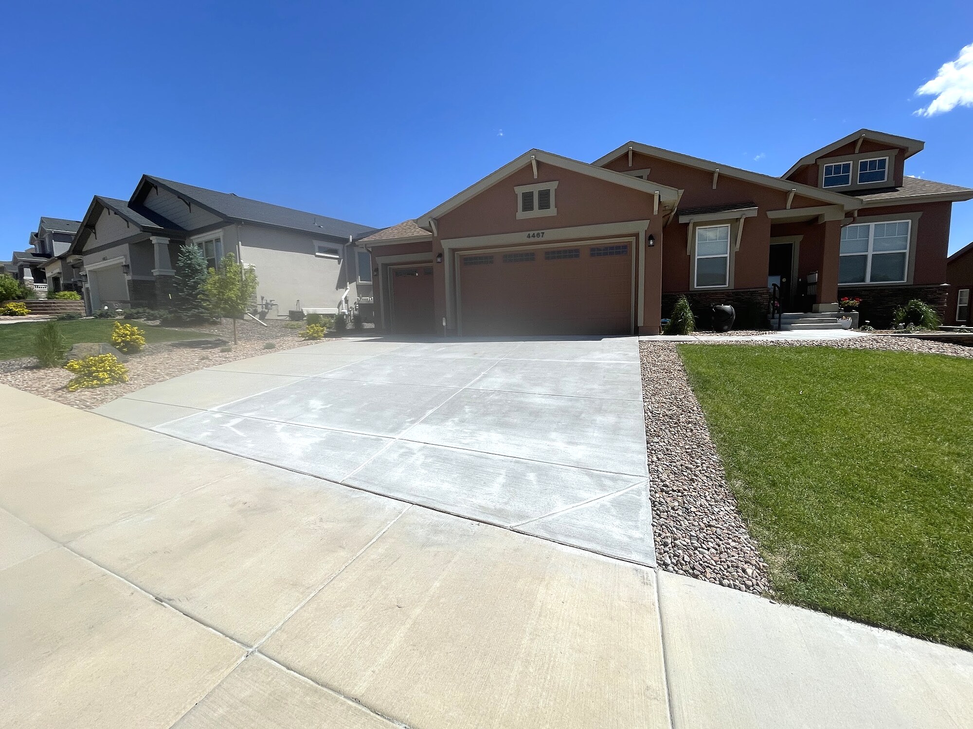 Two-tone decorative concrete driveway at a Colorado Springs home.